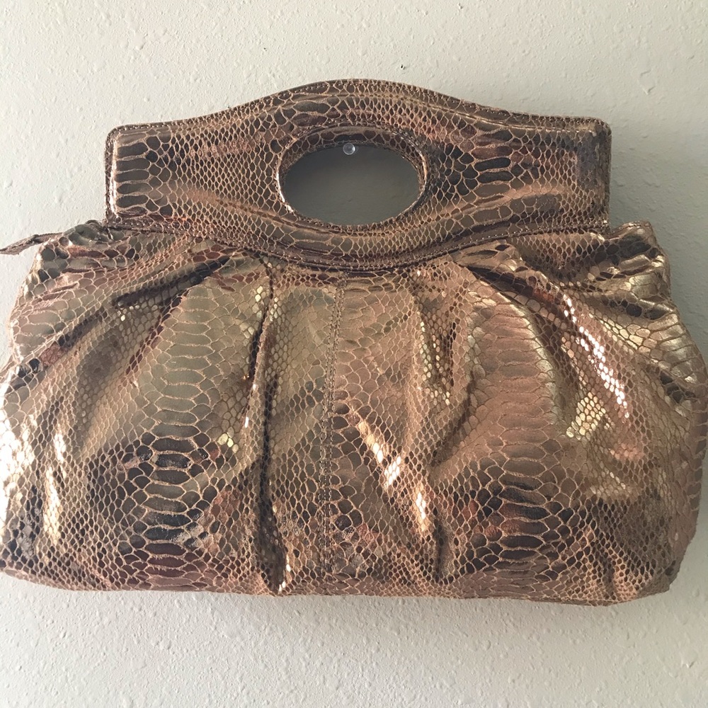 “Kristine” brand golden clutch purse